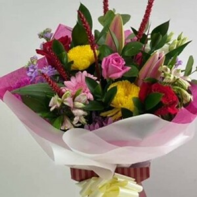 Tall front facing bouquet - A feont facing bouquet made with Bright colours mixed with roses, lilies and other inspiring colours.