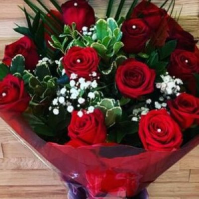 Red roses bouquet - Red roses mixed with beautiful foliage and finished in a luxury wrap presented,  in a beautiful display