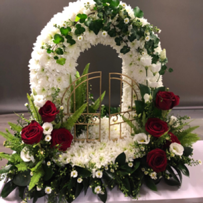 Gates of heaven Reds - Made with white chrysanthemums and red roses to Create a truly authentic piece of work for a funeral tribute