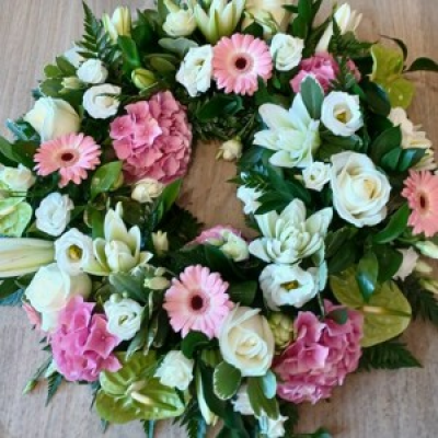 Funeral wreath - A ring filled with hydrangeas, anthurimums, double lilies, roses and germini, a truly inspiring piece.