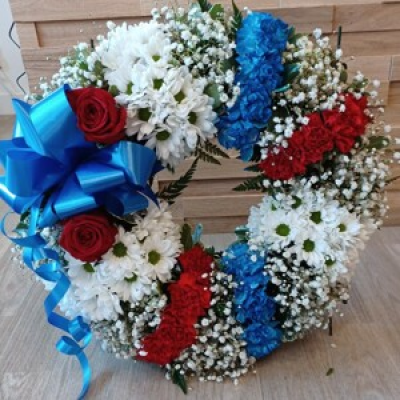 Wreath - Wreath Ring made in sections of different colours, with a side bow on a stand, it is a beautiful piece for a funeral