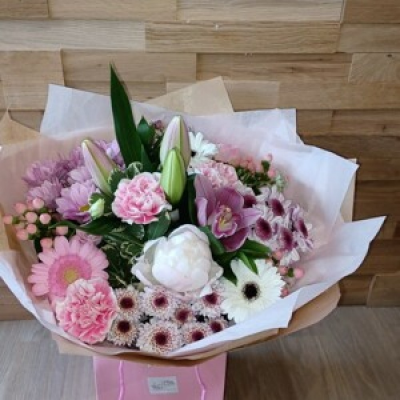 Pastel Hand tie - A Gorgeous bouquet of pastel coloured flowers put together to make a truly inspiring bouquet for that special birthday, anniversary and even just to surprise someone and cheer them up. The flowers may differ depending on the season, however, they will be made and packaged with care and delivered to that special someone.