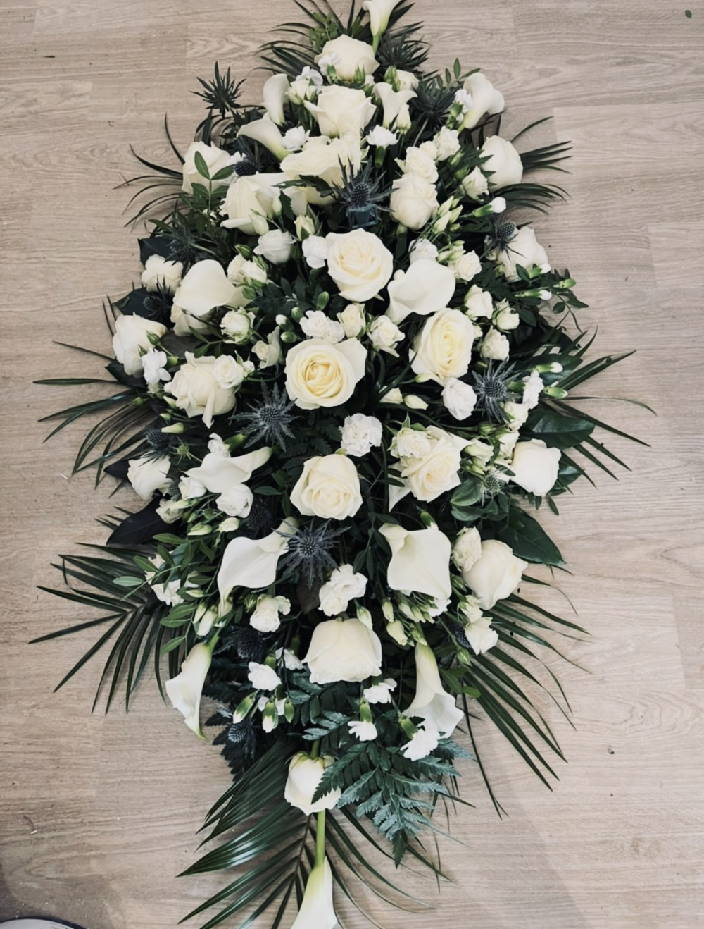 White rose and calla lily coffin spray